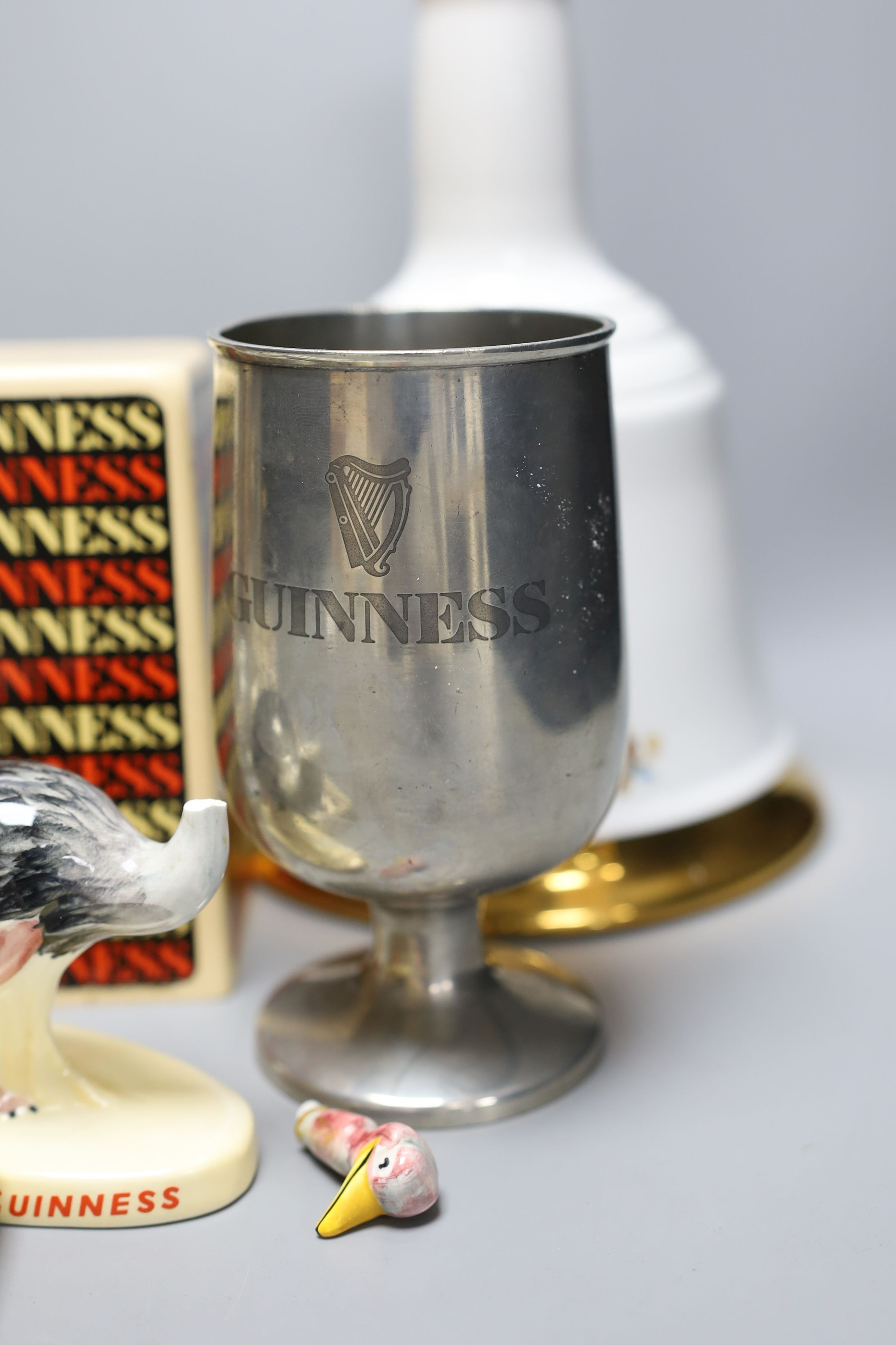 Assorted Guiness memorabilia, a Bells porcelain bottle of whisky, commemorative to the 60th birthday of Her Majesty Queen Elizabeth II